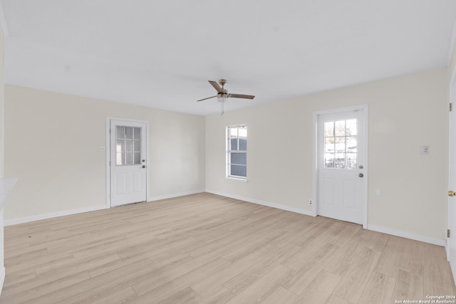 interior space with light hardwood / wood-style floors and ceiling fan