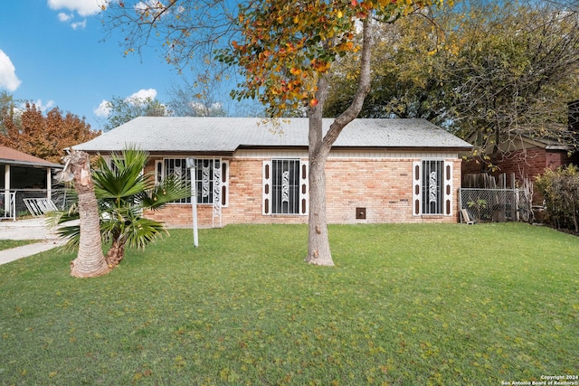 rear view of house with a lawn