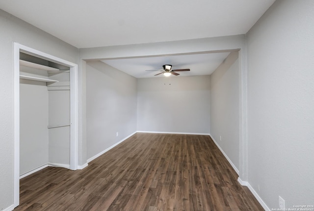 unfurnished bedroom with a closet, ceiling fan, and dark wood-type flooring