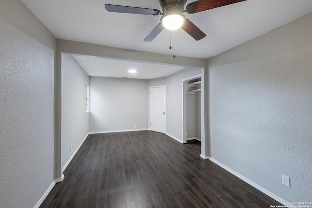 spare room featuring dark hardwood / wood-style floors and ceiling fan