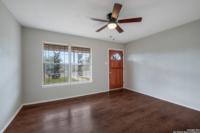 foyer entrance with ceiling fan and dark hardwood / wood-style floors