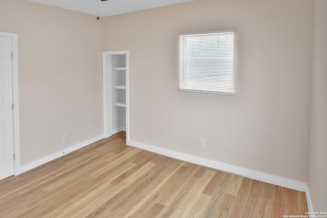 unfurnished room with light hardwood / wood-style floors