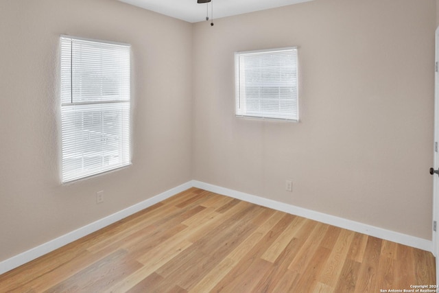 unfurnished room featuring ceiling fan and light hardwood / wood-style floors