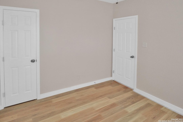 spare room featuring light hardwood / wood-style flooring