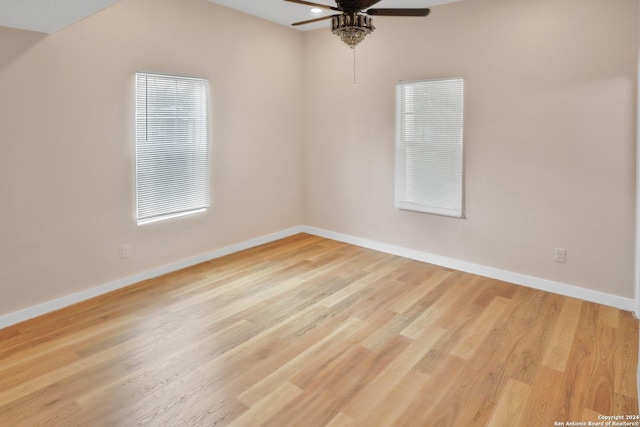 spare room featuring ceiling fan and light wood-type flooring