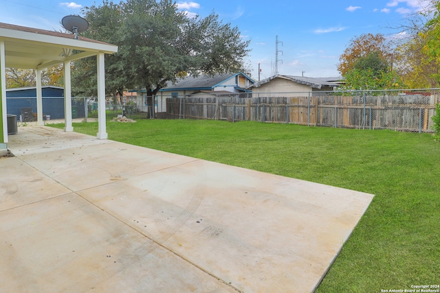 view of yard featuring a patio area and central air condition unit