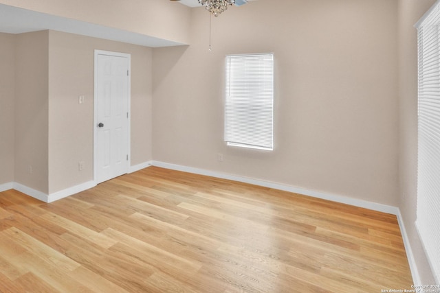 unfurnished room featuring light hardwood / wood-style flooring, ceiling fan, and a healthy amount of sunlight