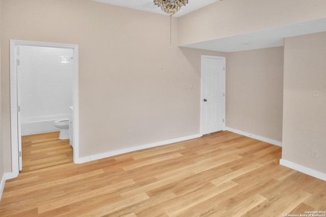 empty room with light hardwood / wood-style floors