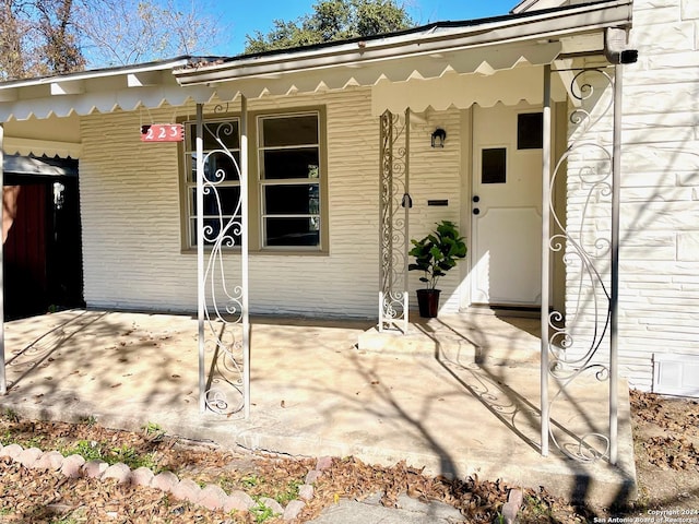 property entrance with a patio area