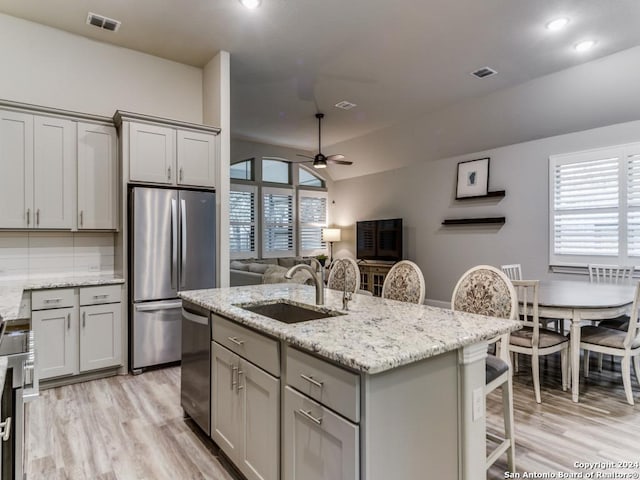 kitchen with ceiling fan, sink, a healthy amount of sunlight, and appliances with stainless steel finishes