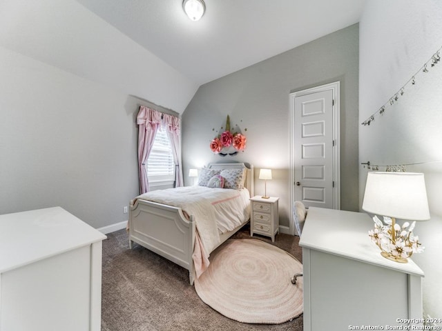 bedroom with carpet and vaulted ceiling