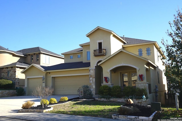 view of front facade featuring french doors and a garage