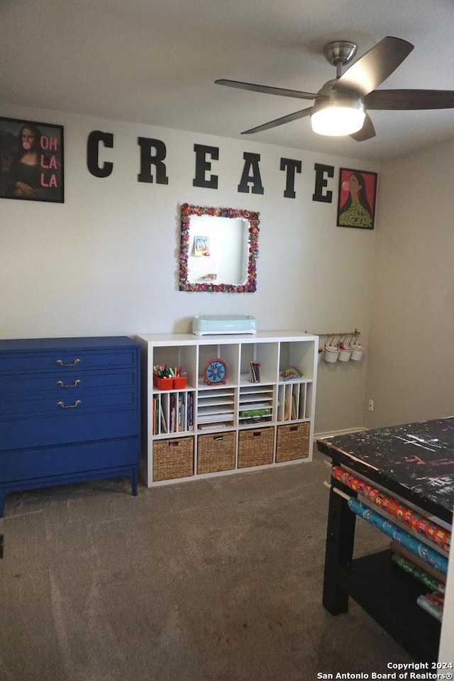 playroom featuring ceiling fan and carpet floors