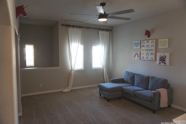 carpeted living room featuring ceiling fan