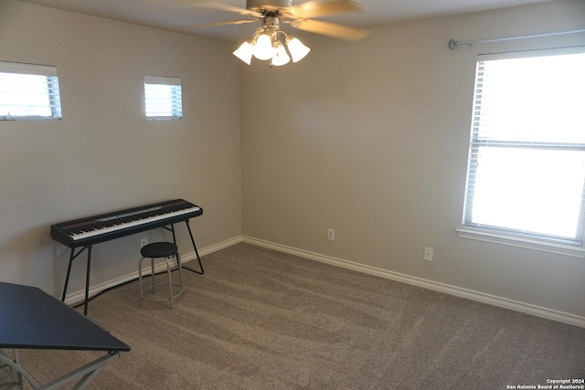 spare room with carpet and ceiling fan