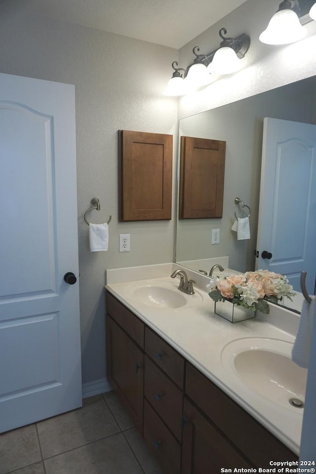 bathroom with tile patterned floors and vanity