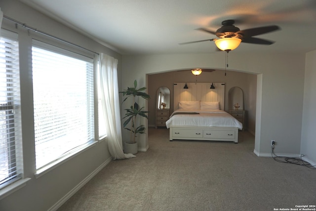 carpeted bedroom featuring ceiling fan