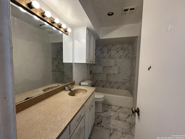 full bathroom featuring vanity, toilet, and tiled shower / bath