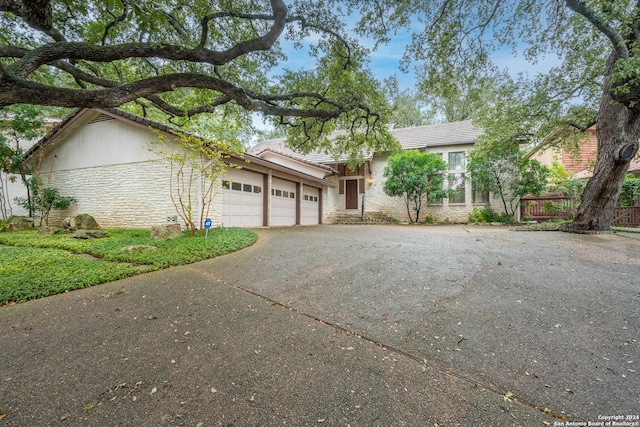 single story home with a garage