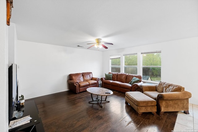 living room featuring hardwood / wood-style flooring and ceiling fan