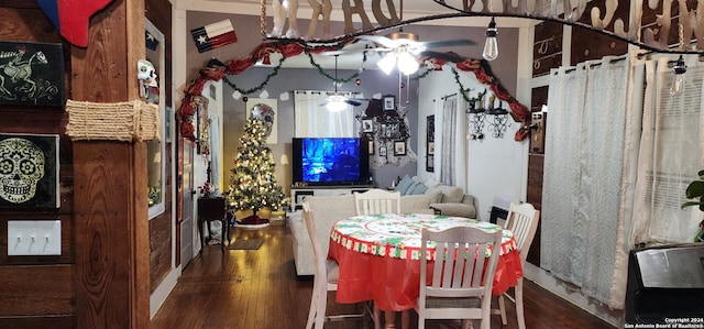 dining area with dark hardwood / wood-style floors and ceiling fan