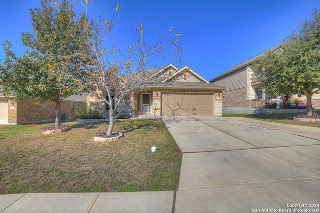 ranch-style home with a garage and a front lawn