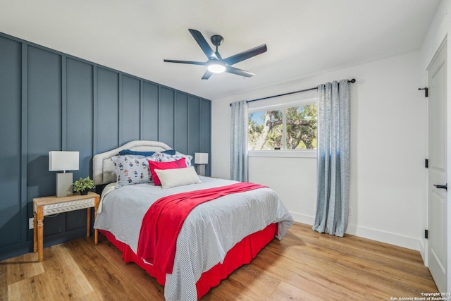 bedroom featuring ceiling fan and light hardwood / wood-style flooring