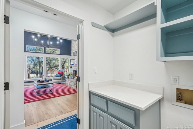 kitchen featuring hardwood / wood-style flooring and gray cabinetry