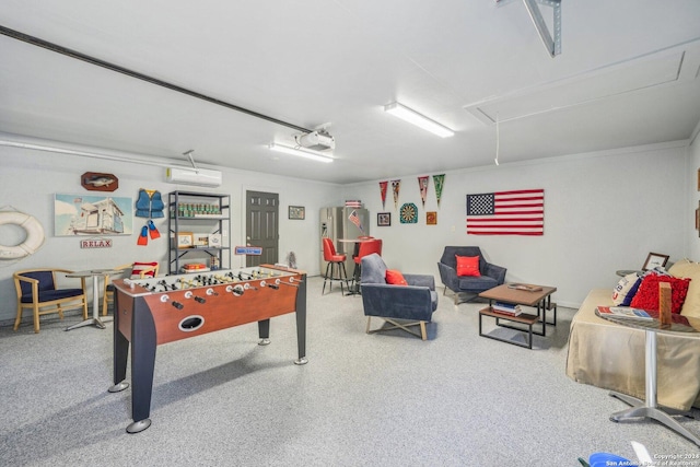 recreation room featuring a wall unit AC