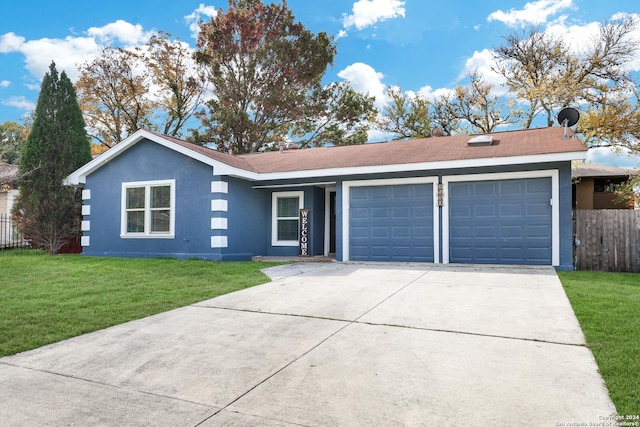 single story home featuring a garage and a front lawn