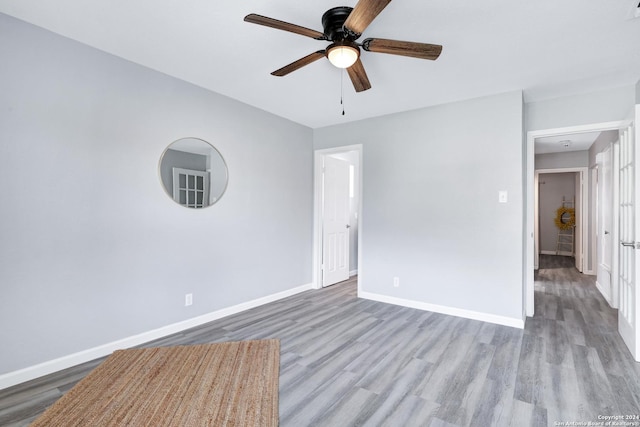 spare room featuring ceiling fan and light wood-type flooring