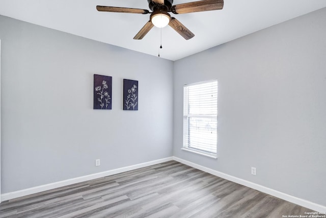 unfurnished room featuring light hardwood / wood-style flooring and ceiling fan