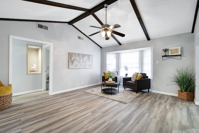 living area featuring ceiling fan, beam ceiling, high vaulted ceiling, and light hardwood / wood-style flooring