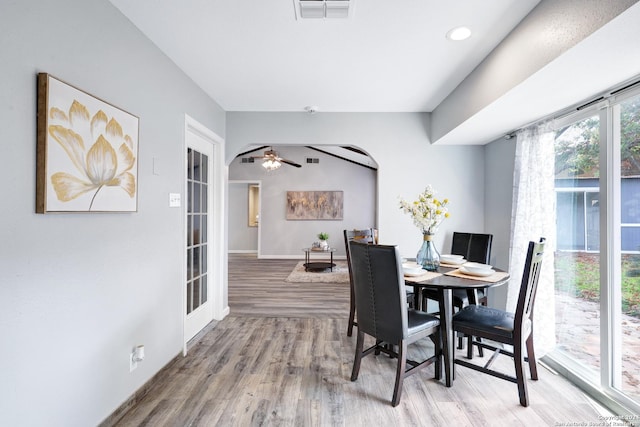 dining area with ceiling fan and wood-type flooring