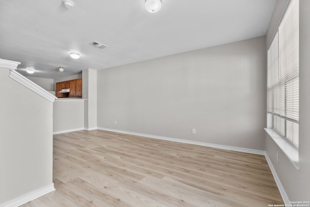 spare room with light hardwood / wood-style flooring