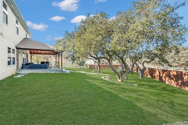 view of yard with an outdoor living space and a patio area