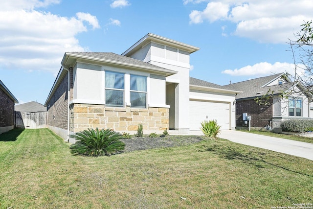 view of front of property with a garage and a front yard