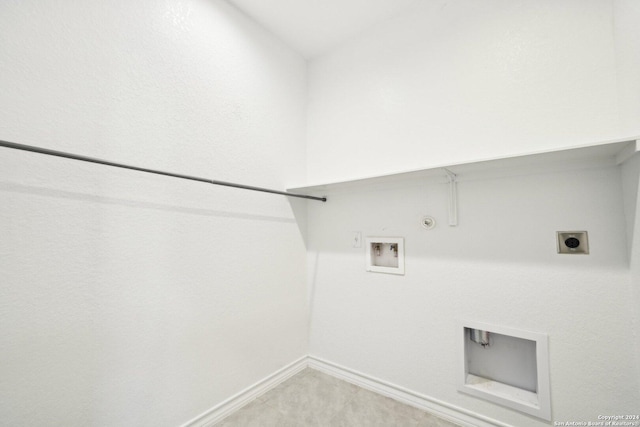 clothes washing area with hookup for a washing machine, hookup for a gas dryer, and electric dryer hookup