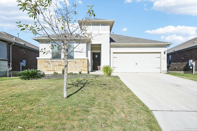 view of front of house featuring a garage and a front lawn