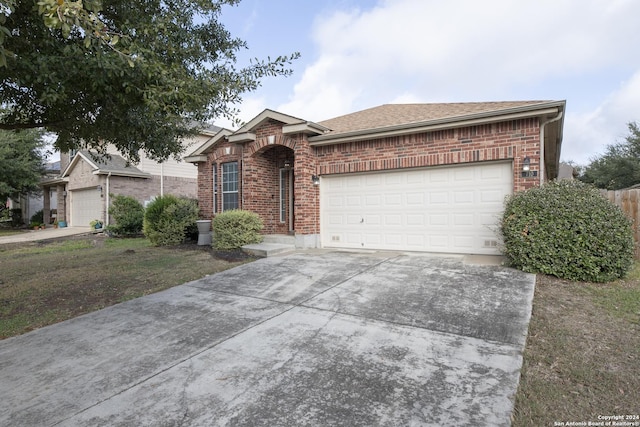 ranch-style home featuring a garage