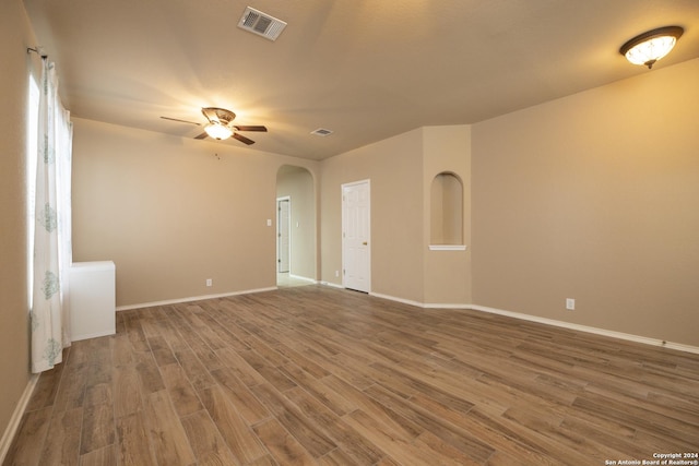 spare room featuring hardwood / wood-style flooring and ceiling fan