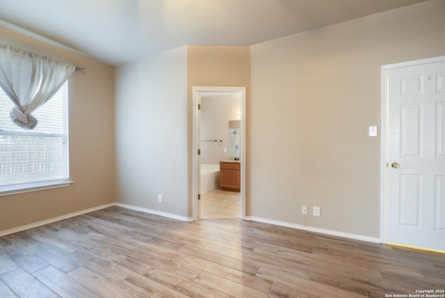 spare room with light wood-type flooring