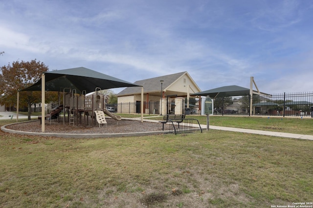 view of jungle gym featuring a lawn