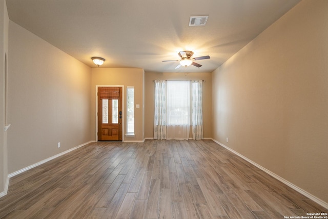 entrance foyer with hardwood / wood-style floors and ceiling fan