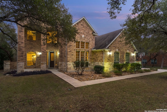 view of front of home with a lawn