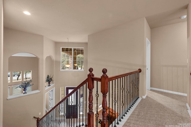 hallway featuring carpet