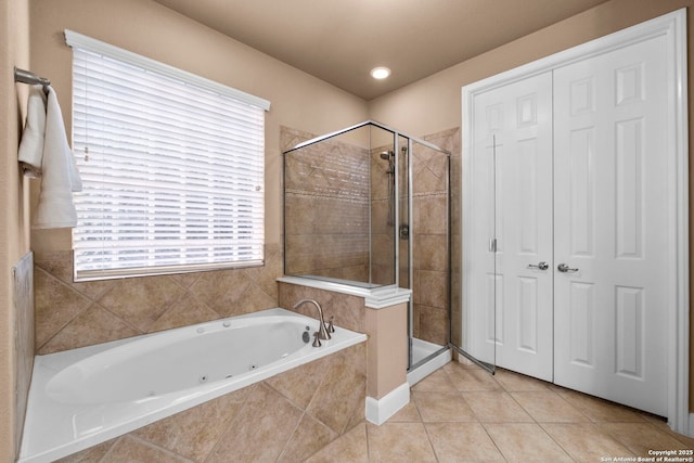 bathroom with tile patterned flooring and plus walk in shower