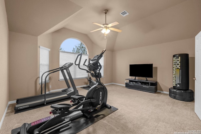 workout area featuring ceiling fan, light carpet, and vaulted ceiling