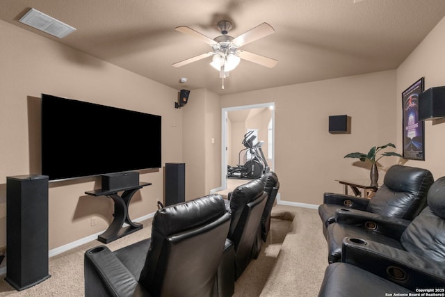 home theater featuring light carpet and ceiling fan