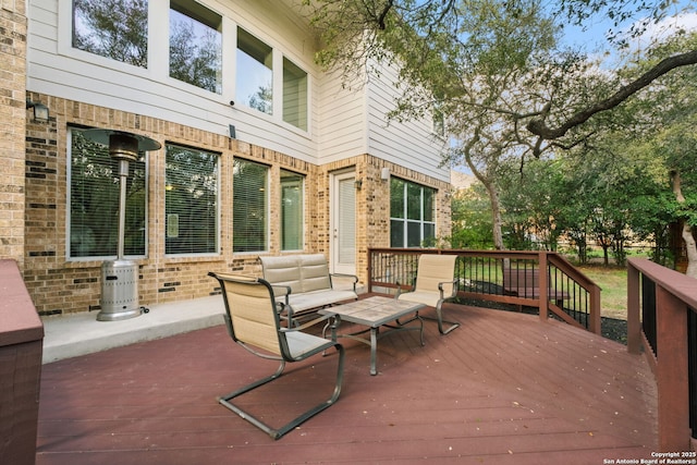 wooden deck with an outdoor hangout area